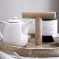 Ronde serveerplank met houten handvat - 